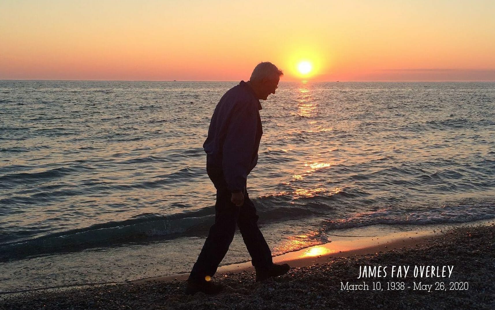 Jim walking on beach at sunset